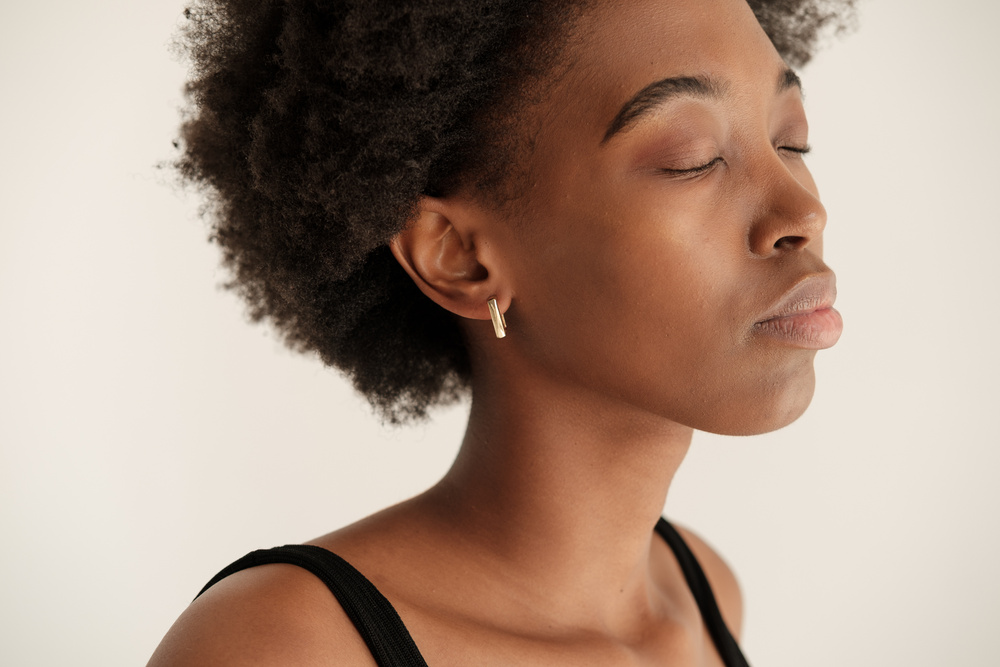 Woman with Minimalist Earrings