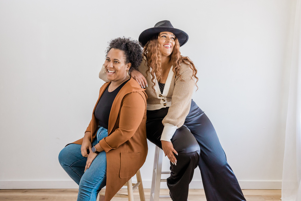 Happy Plus Size Women Sitting on Chairs 